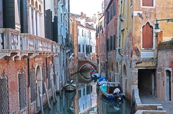 A quiet residential canal in Cannaregio with moored boats and no crowds
